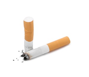 Photo of Two cigarette butts isolated on white. Smoking habit