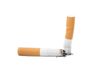 Photo of Two cigarette butts isolated on white. Smoking habit