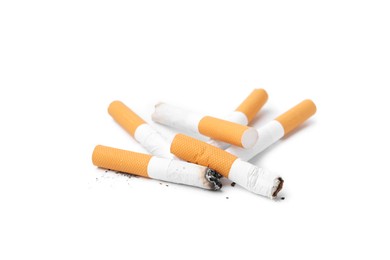 Photo of Many cigarette butts isolated on white. Smoking habit