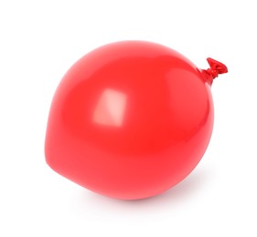 Photo of One red half deflated balloon isolated on white