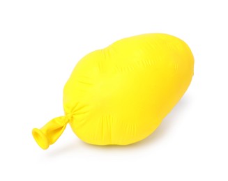 Photo of One yellow half deflated balloon isolated on white