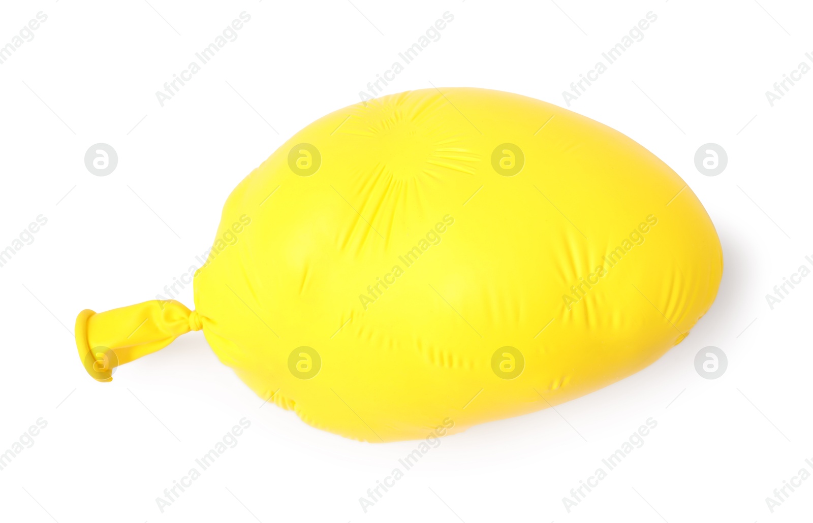 Photo of One yellow half deflated balloon isolated on white, top view