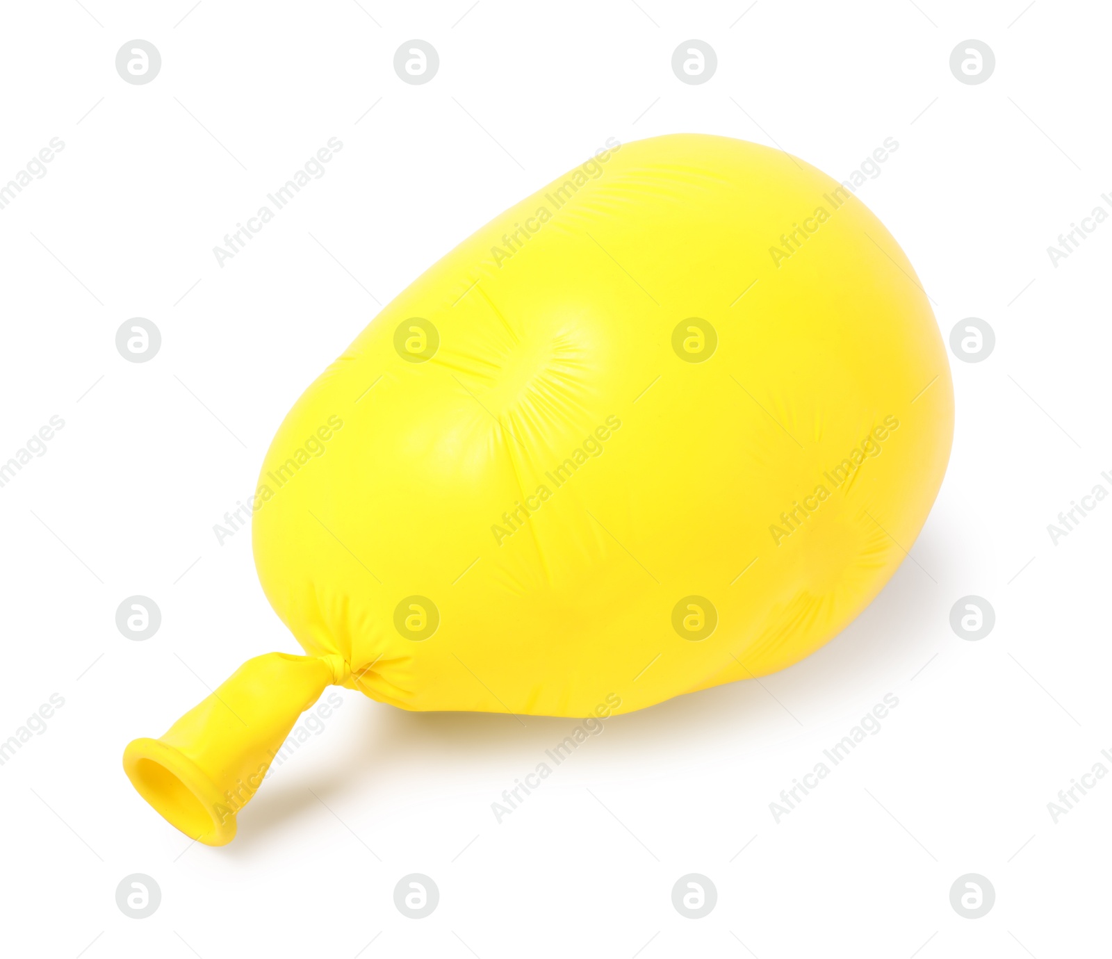 Photo of One yellow half deflated balloon isolated on white