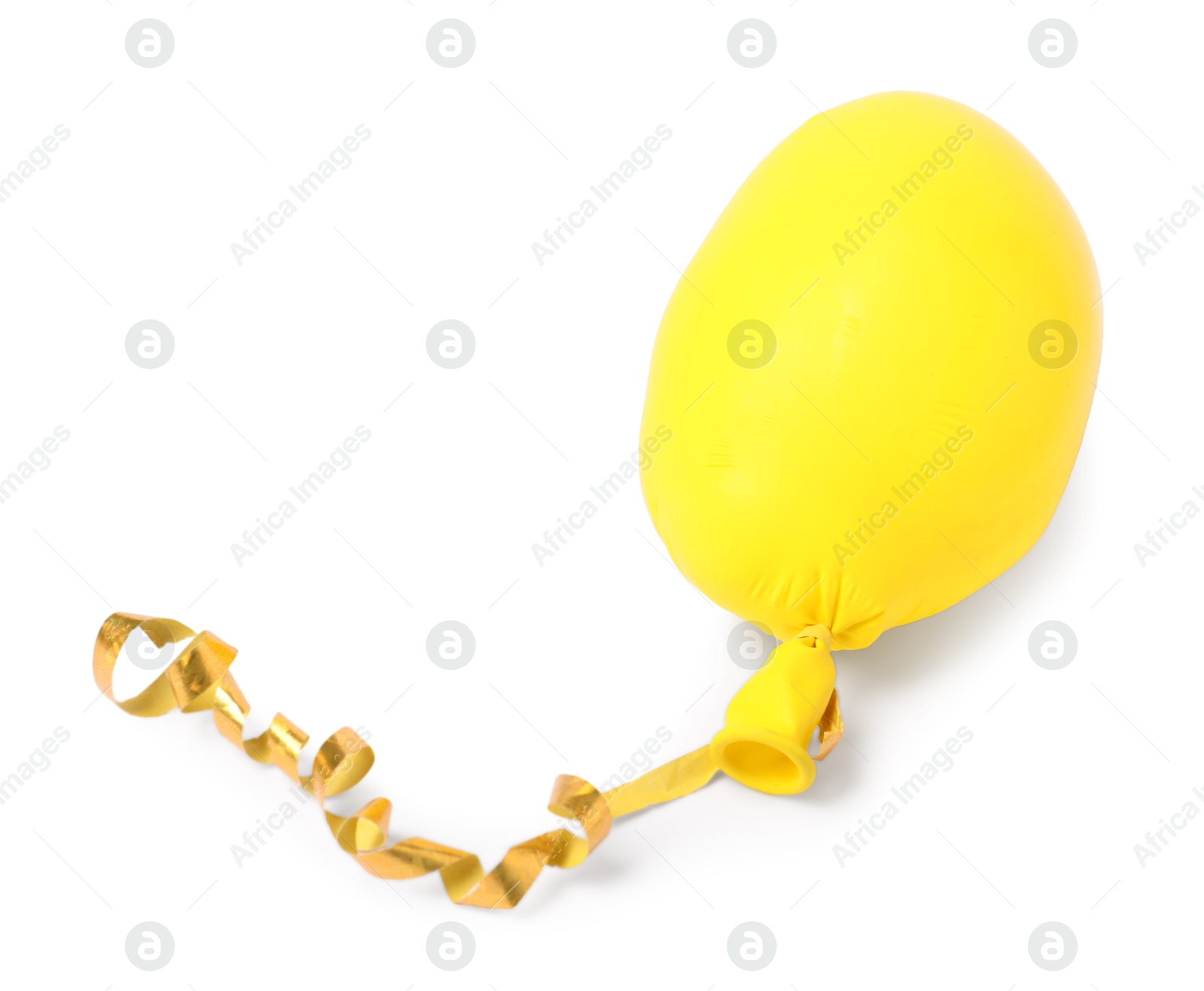 Photo of One yellow half deflated balloon isolated on white