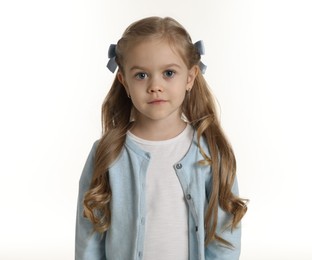 Photo of Cute little girl with beautiful hair accessory on white background