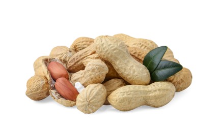 Photo of Pile of fresh peanuts and green leaves isolated on white