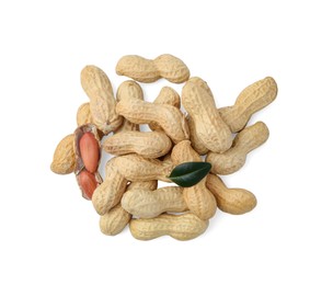 Photo of Pile of fresh peanuts and green leaf isolated on white, top view