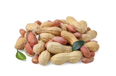 Photo of Pile of different peanuts and green leaves isolated on white