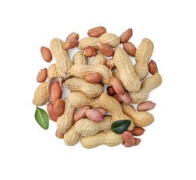 Photo of Pile of different peanuts and green leaves isolated on white, top view