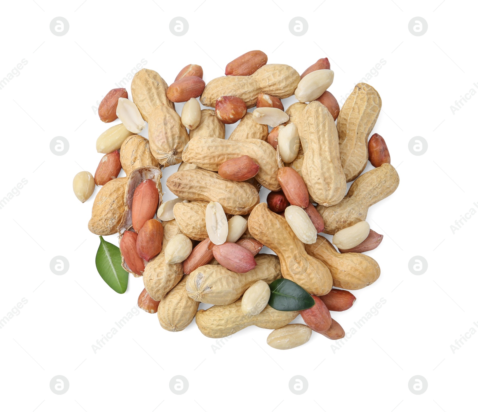 Pile of different peanuts and green leaves isolated on white, top view Photo of Pile of different peanuts and green leaves isolated on white, top view