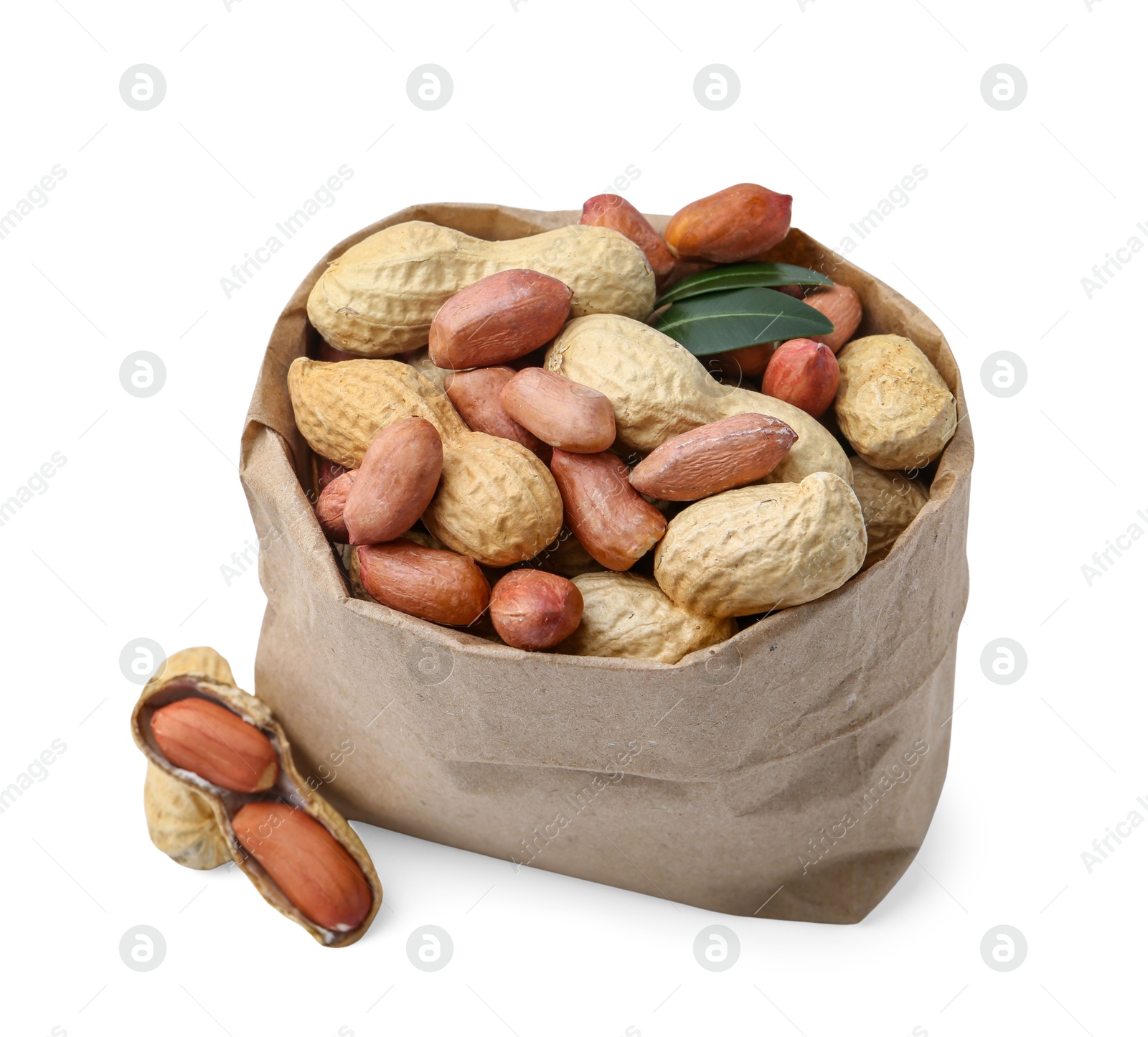 Fresh peanuts in paper bag and green leaves isolated on white Photo of Fresh peanuts in paper bag and green leaves isolated on white