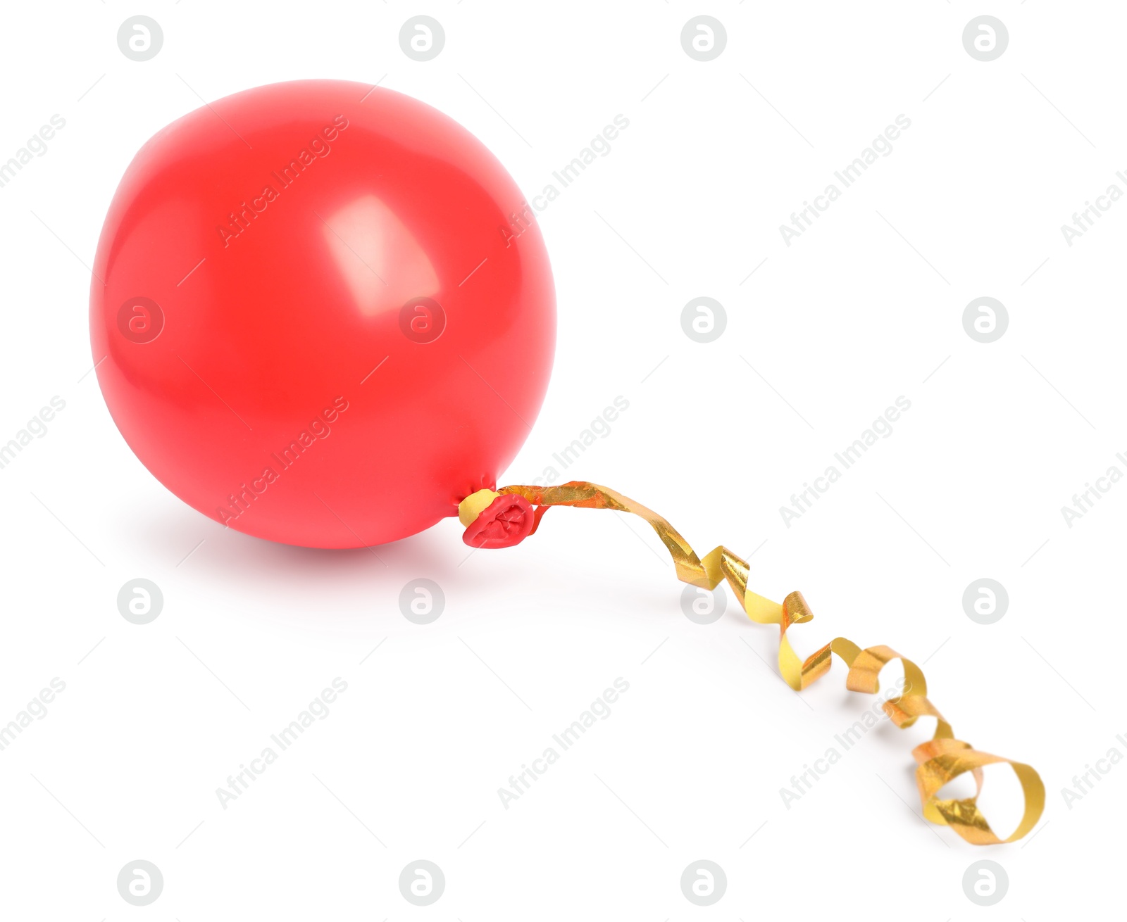 Photo of One red half deflated balloon isolated on white