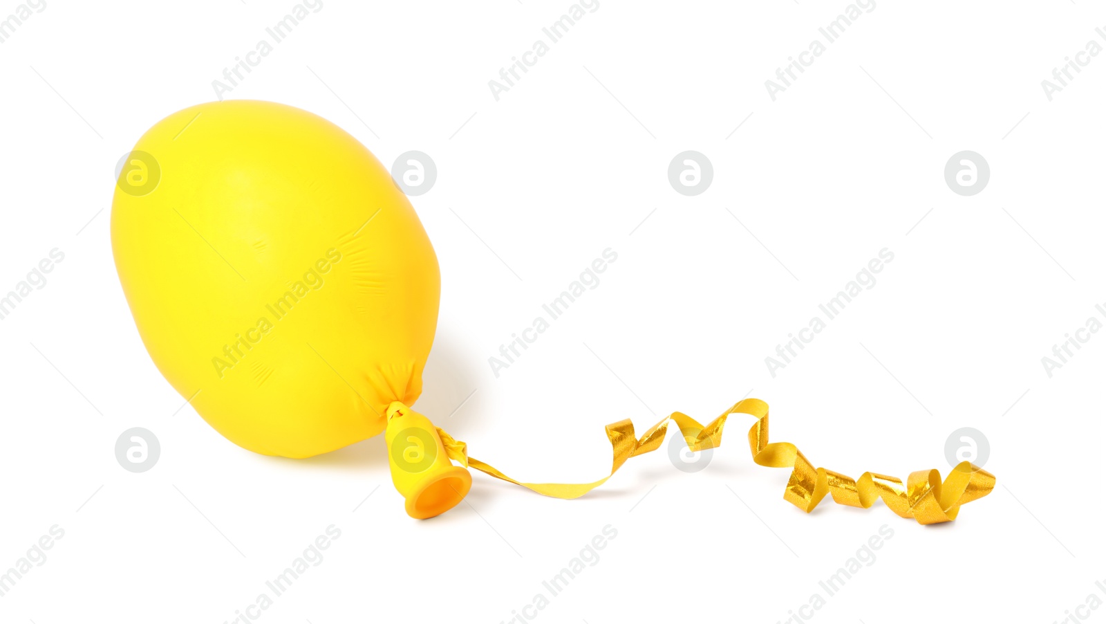 Photo of One yellow half deflated balloon isolated on white