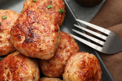 Photo of Delicious patties served on black table, closeup