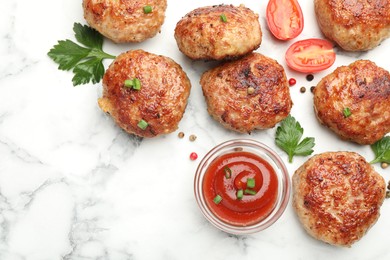 Photo of Delicious patties with sauce, cherry tomatoes, peppercorns and parsley on white marble table, flat lay. Space for text