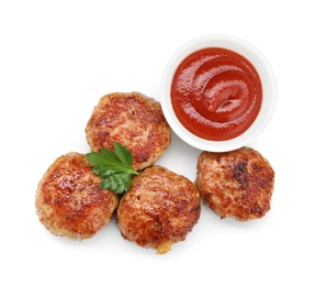 Photo of Delicious patties with sauce and parsley isolated on white, top view