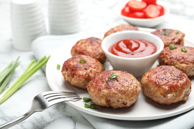 Photo of Delicious patties served on white marble table, closeup