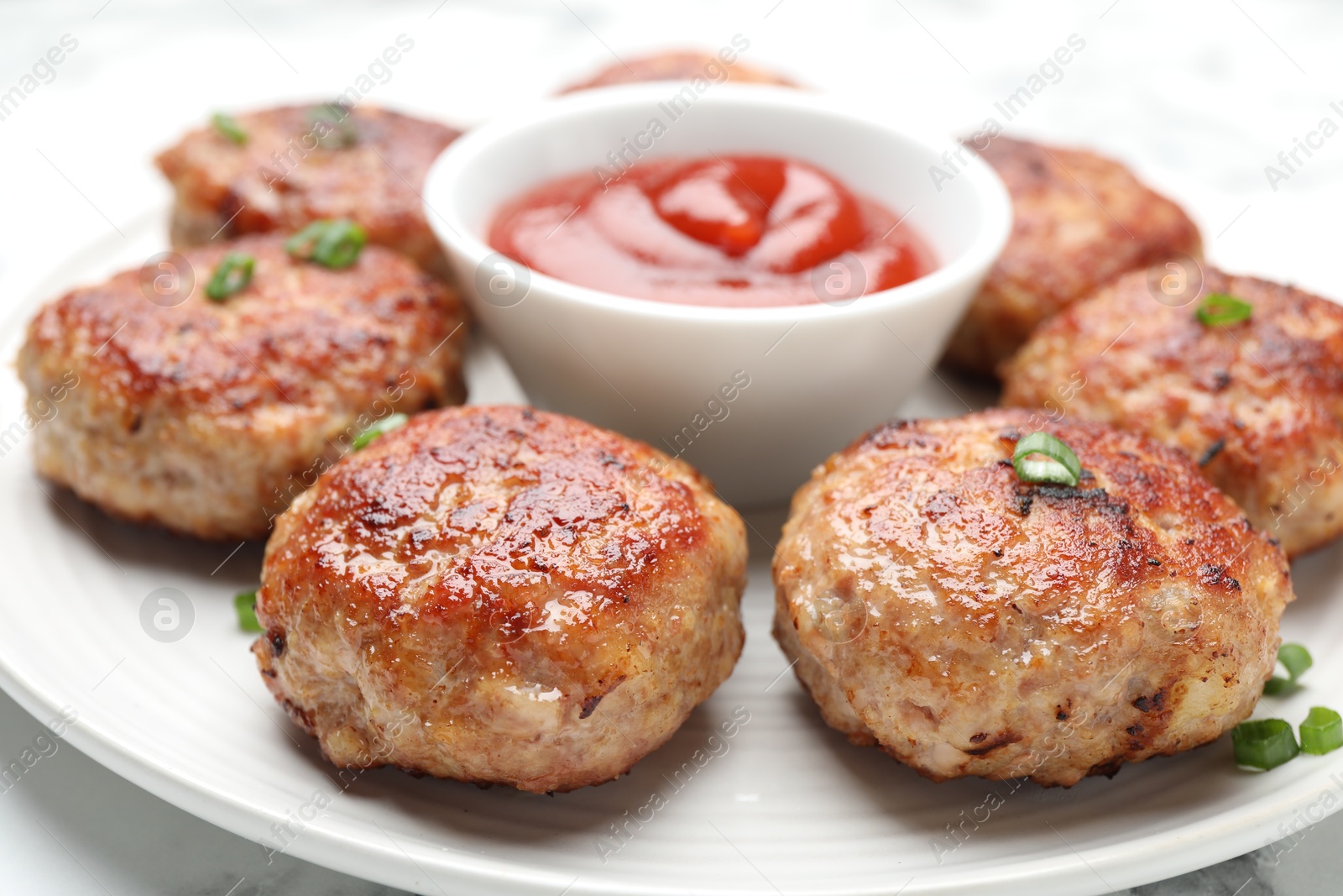 Photo of Delicious patties served on white table, closeup