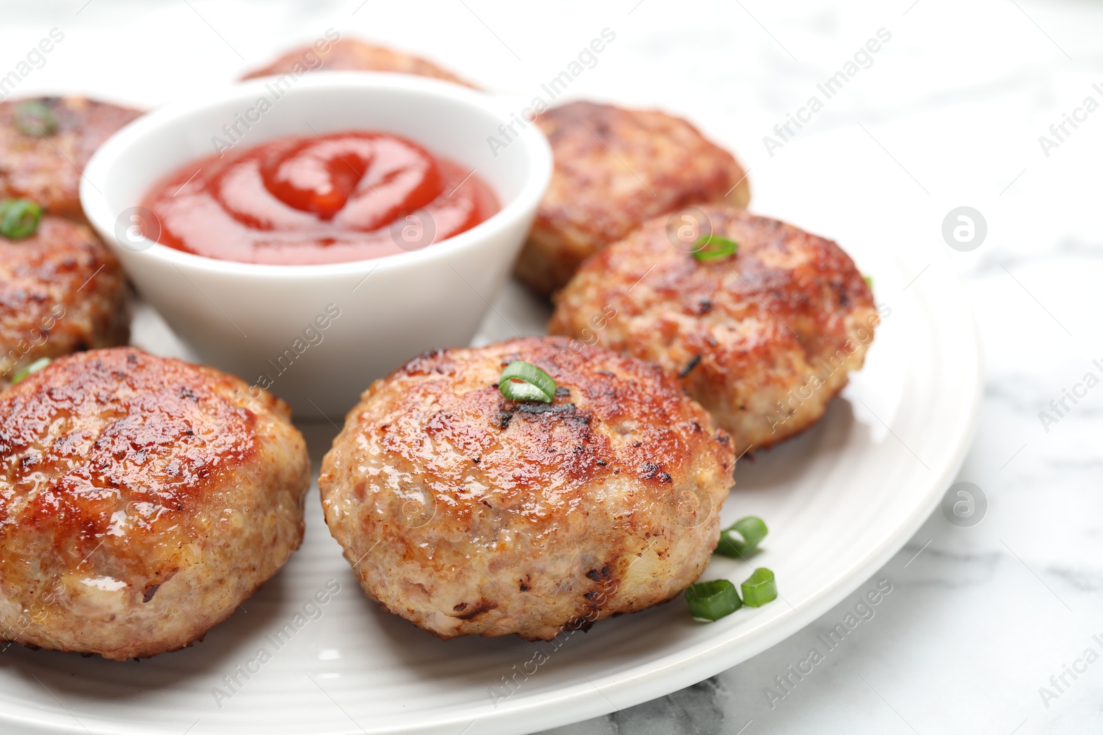 Photo of Delicious patties served on white table, closeup