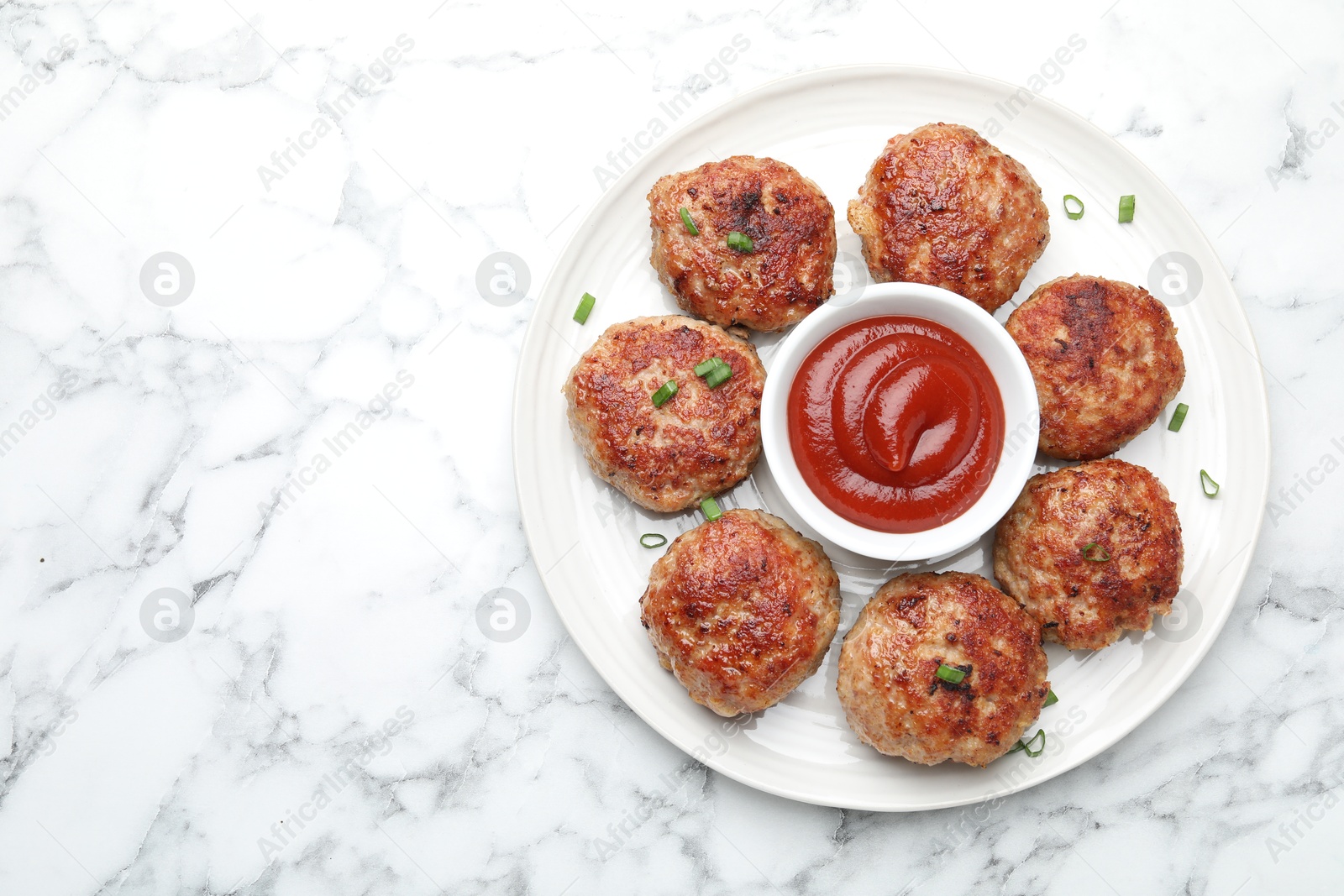 Photo of Delicious patties served on white table, top view. Space for text