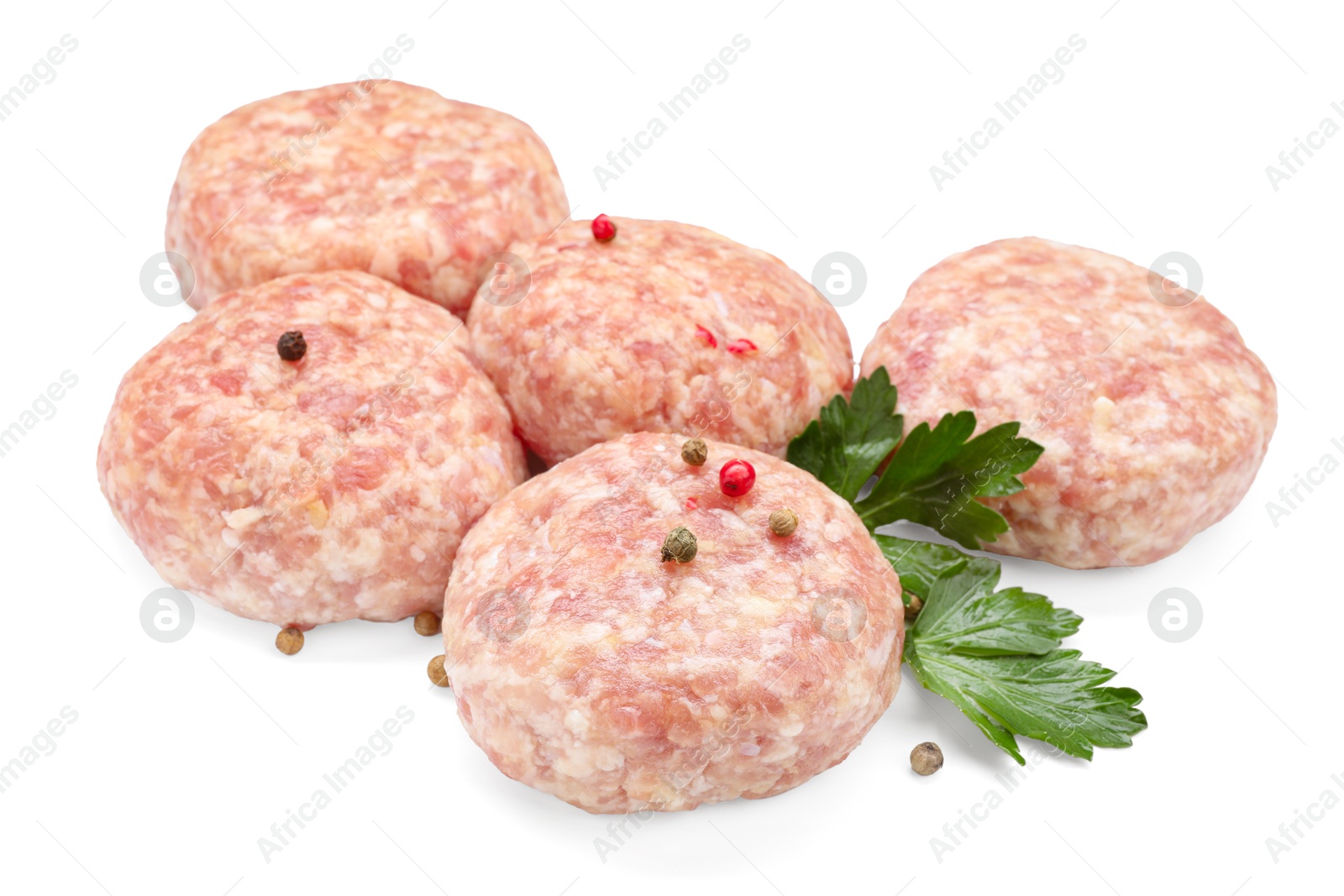 Photo of Many uncooked patties and spices isolated on white