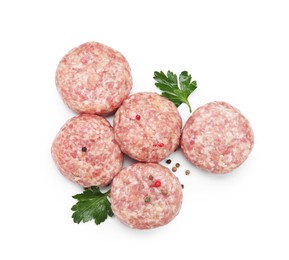 Photo of Many uncooked patties and spices isolated on white, top view