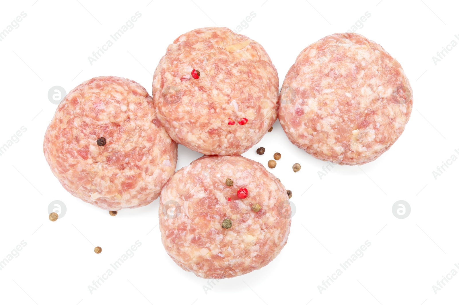 Photo of Many uncooked patties and spices isolated on white, top view