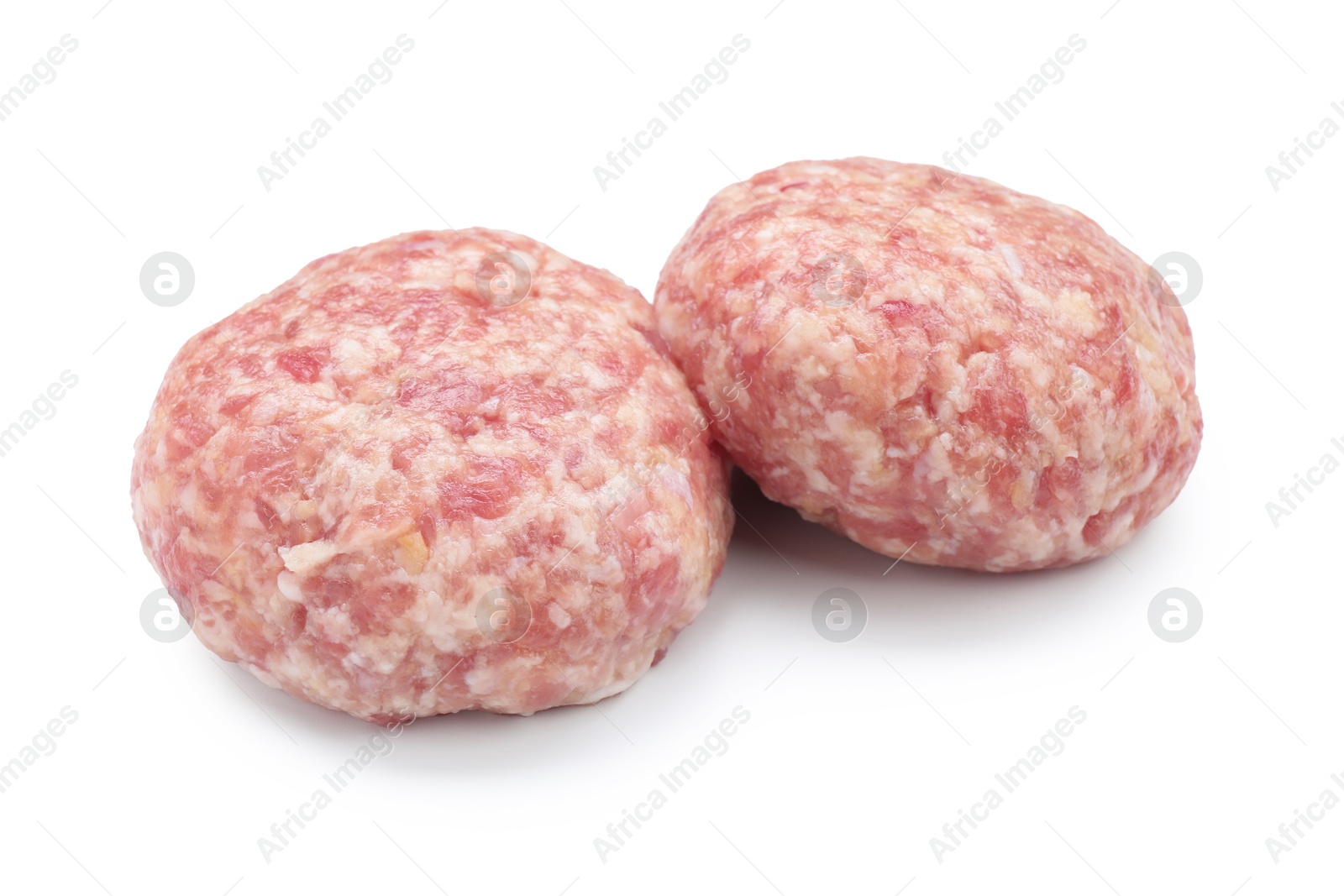 Photo of Two uncooked fresh patties isolated on white