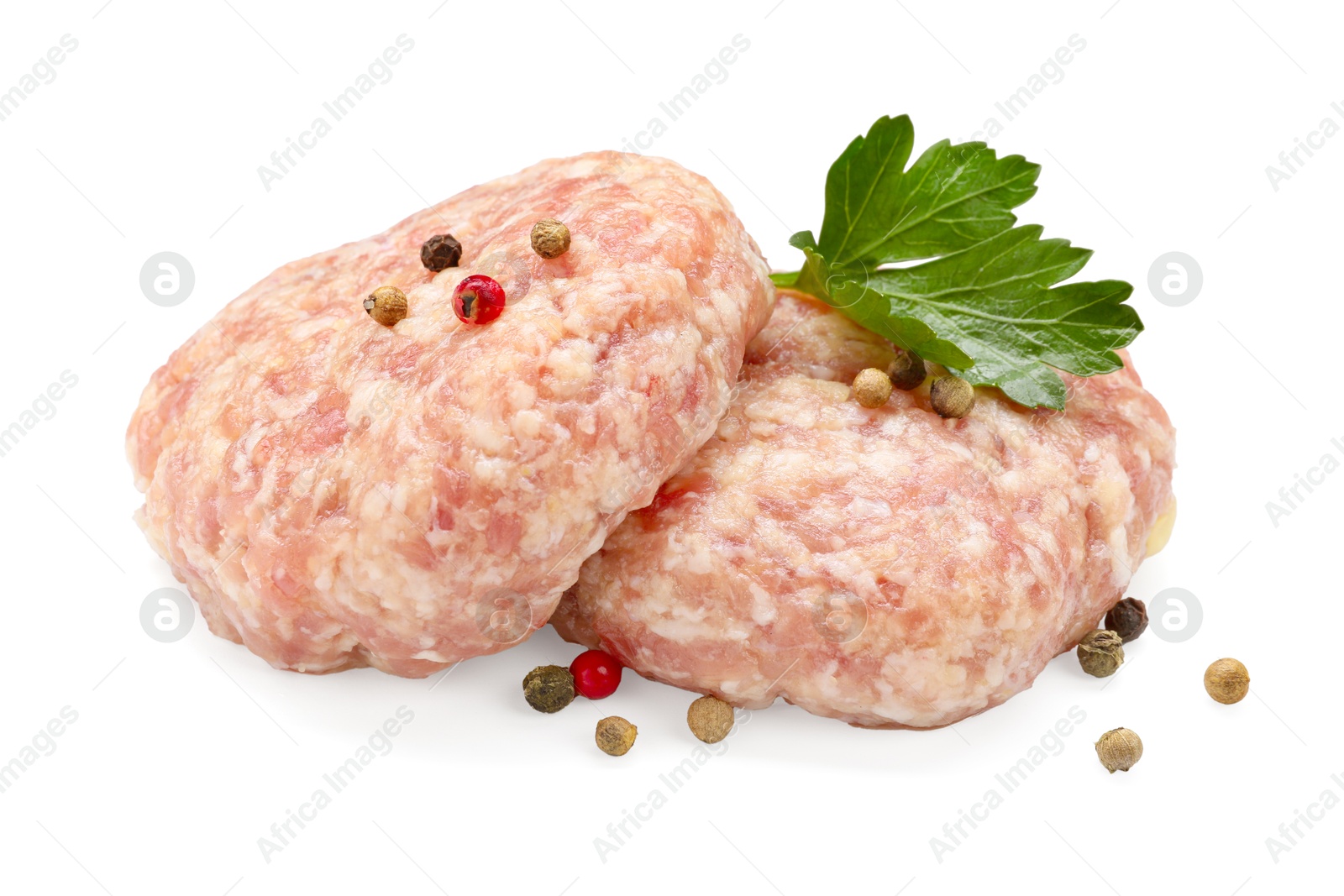 Photo of Two uncooked patties and spices isolated on white