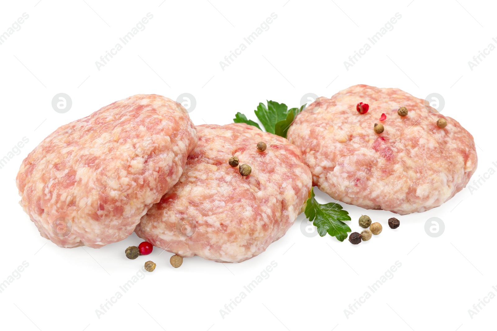 Photo of Three uncooked patties and spices isolated on white