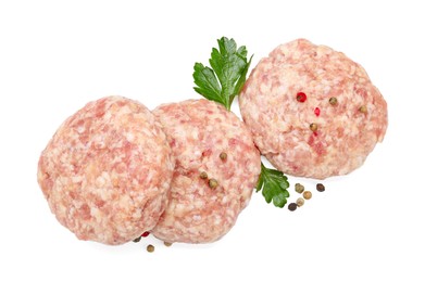 Photo of Three uncooked patties and spices isolated on white, top view