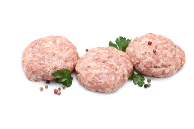 Photo of Three uncooked patties and spices isolated on white