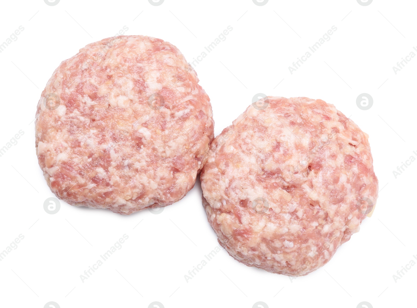 Photo of Two uncooked fresh patties isolated on white, top view