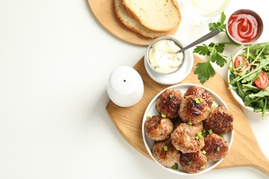 Photo of Delicious patties served on white table, flat lay. Space for text