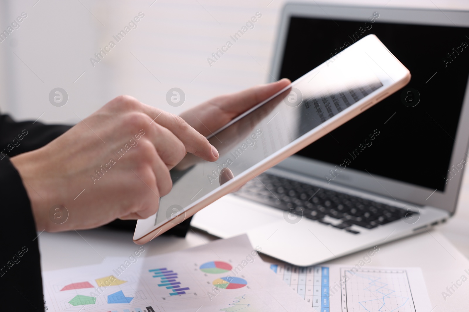 Photo of Electronic signature. Man using tablet at table, closeup