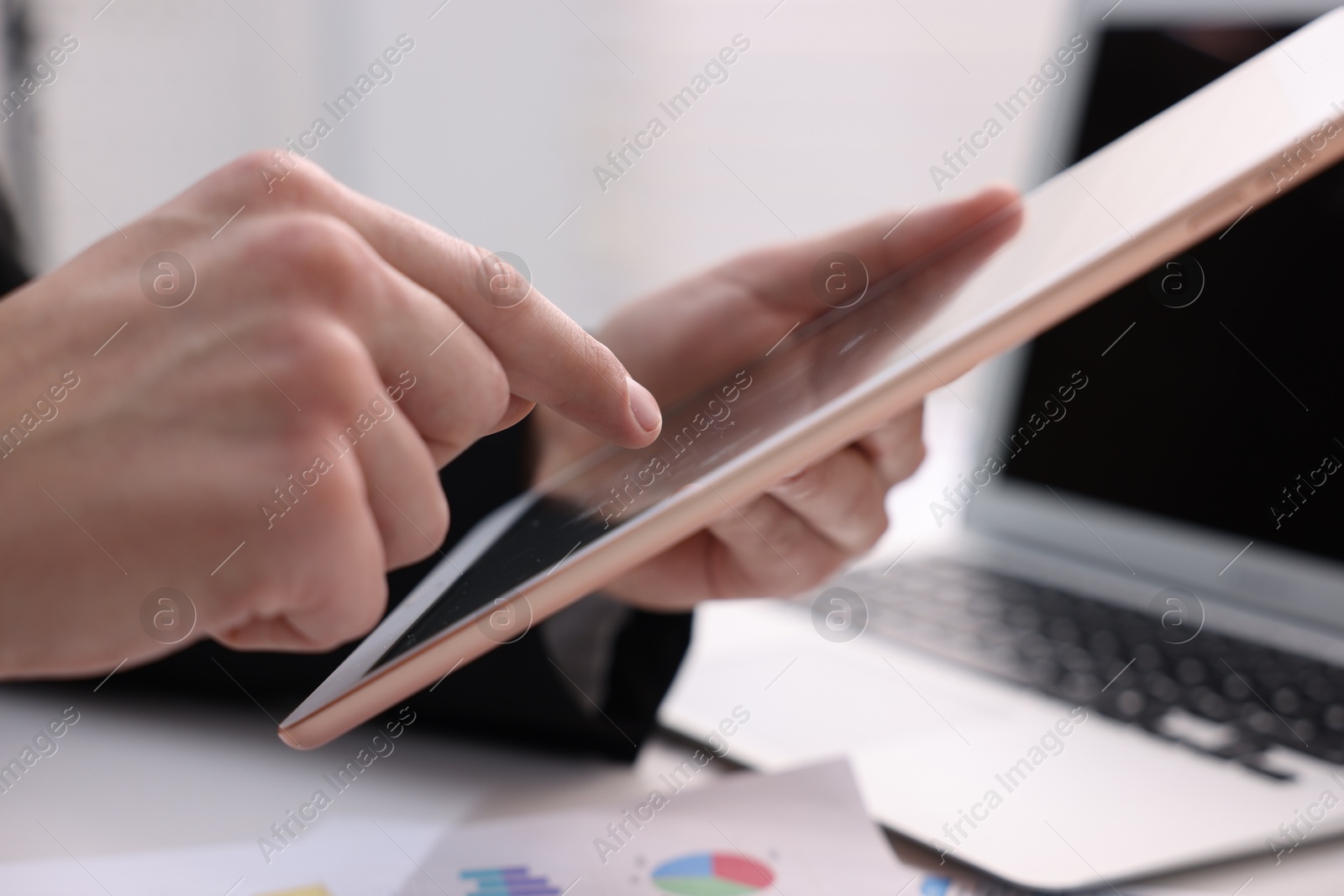 Photo of Electronic signature. Man using tablet at table, closeup