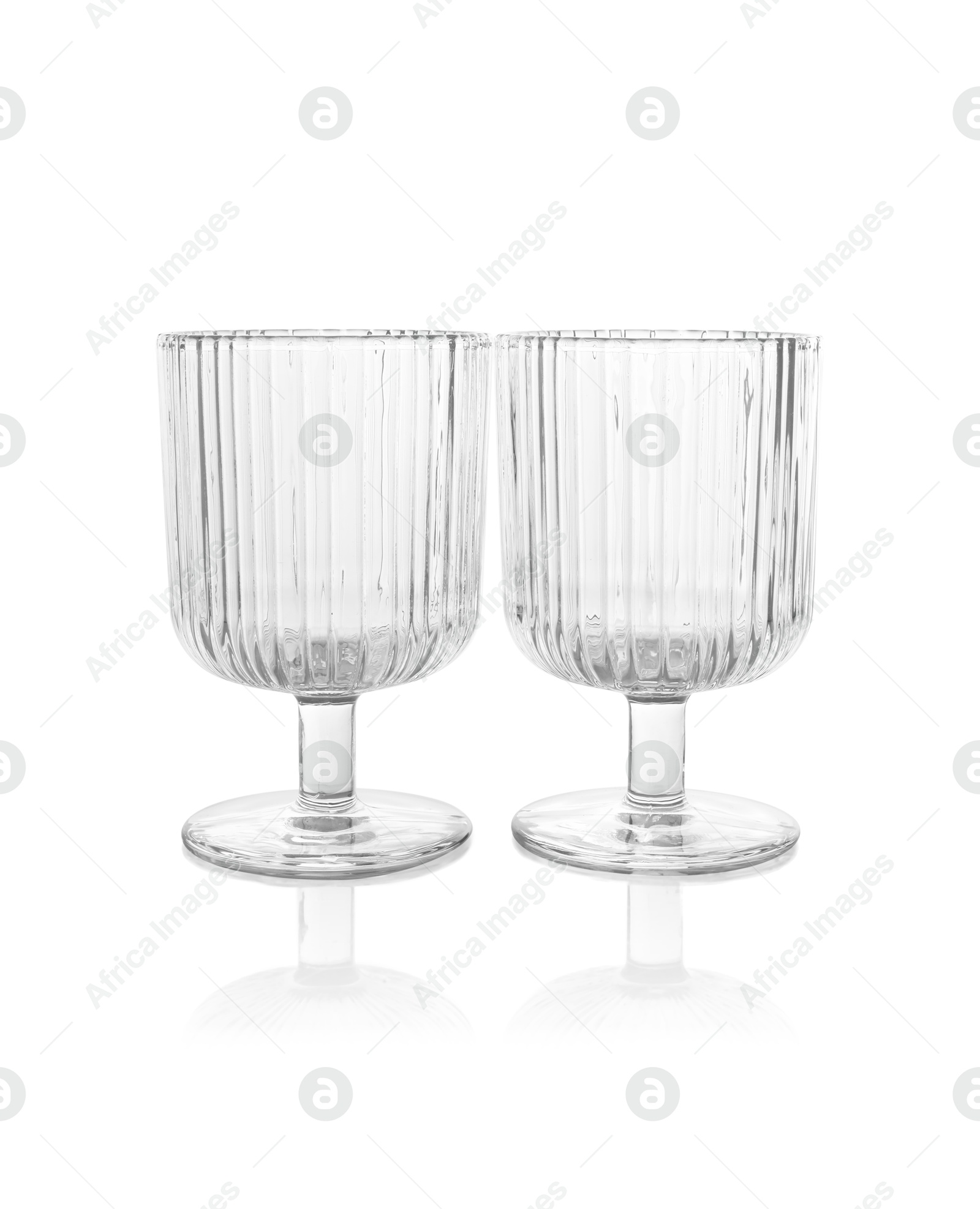 Photo of Two empty clean glasses isolated on white