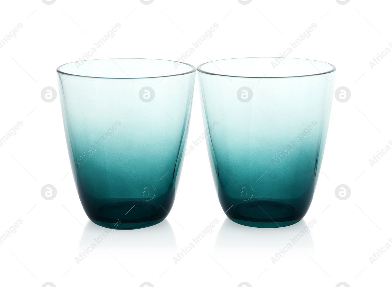 Photo of Two empty clean glasses isolated on white