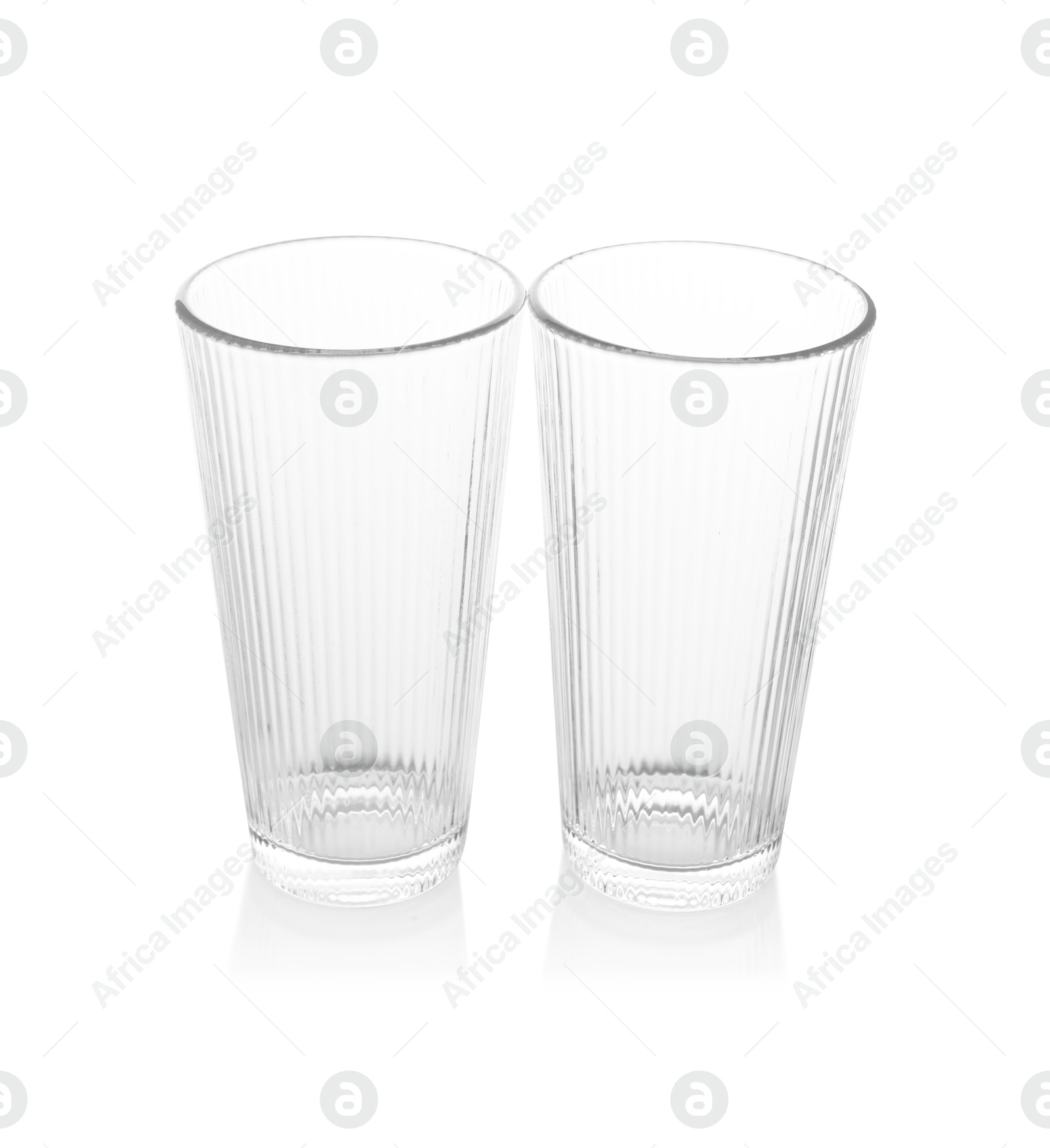 Photo of Two empty clean glasses isolated on white