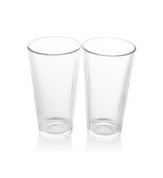 Photo of Two empty clean glasses isolated on white