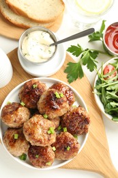 Photo of Delicious patties served on white table, flat lay