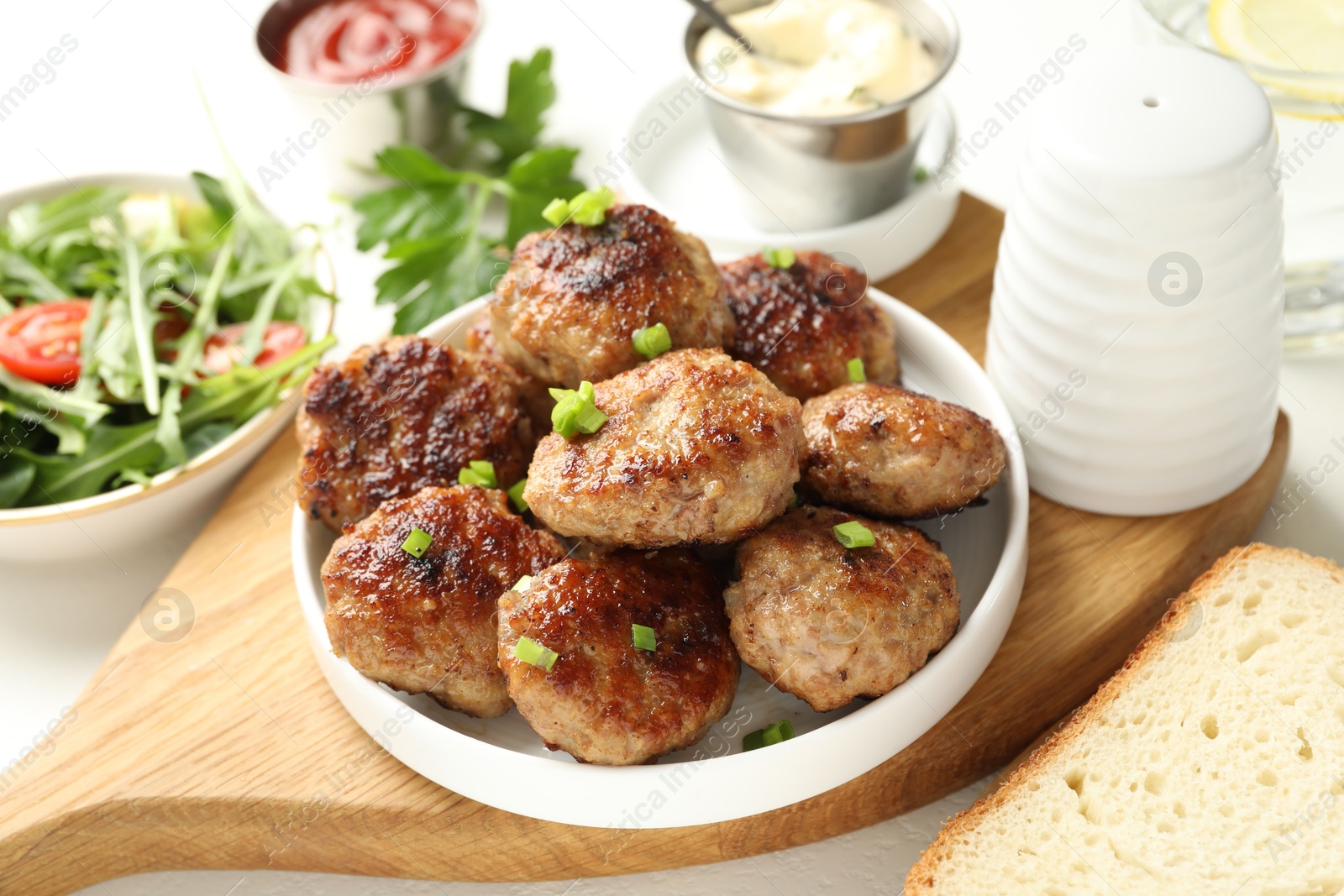 Photo of Delicious patties with green served on table, closeup