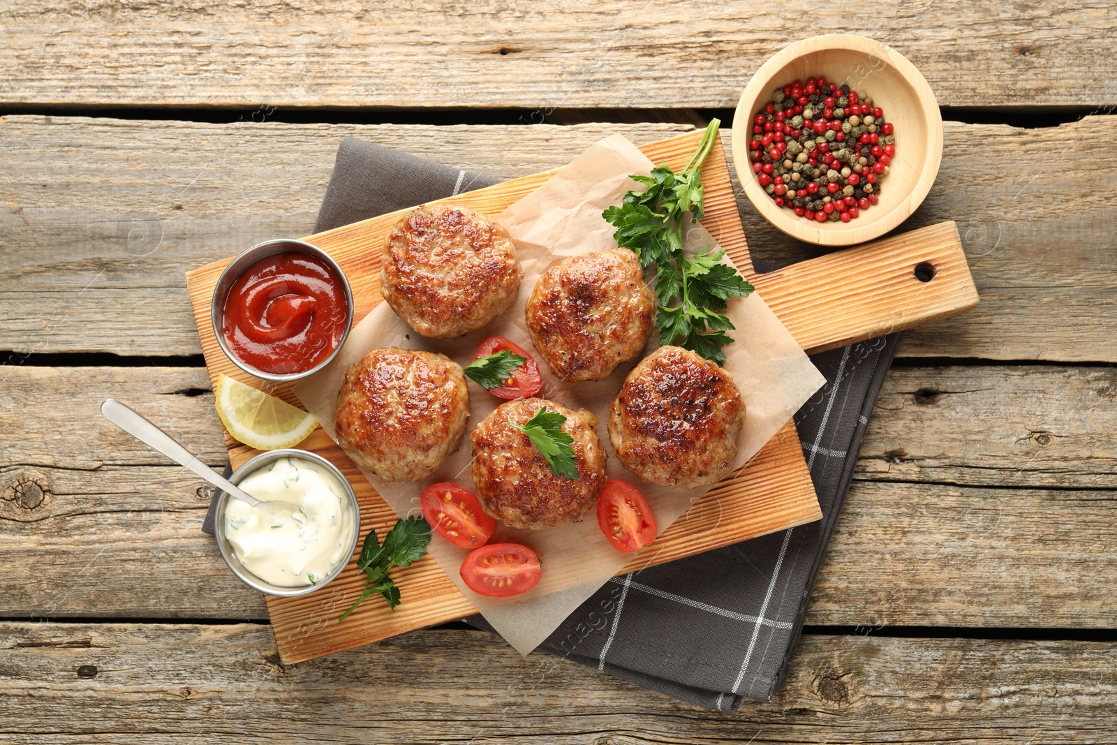 Photo of Delicious patties served on wooden table, flat lay