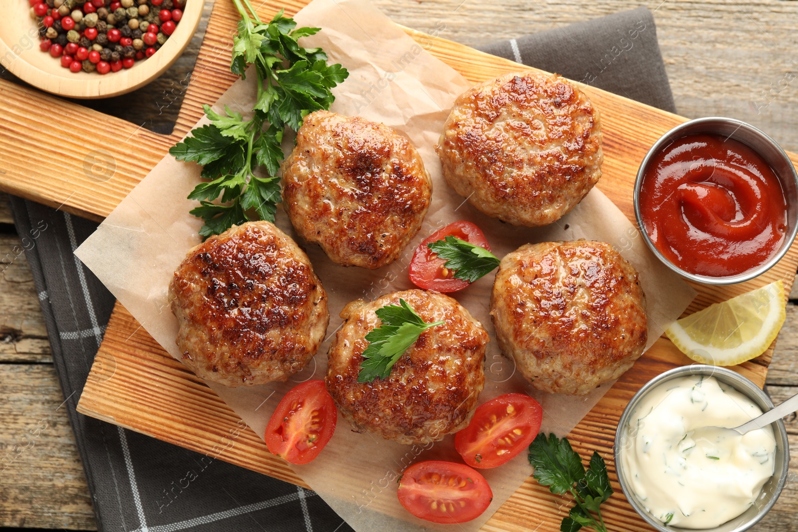 Photo of Delicious patties served on wooden table, flat lay