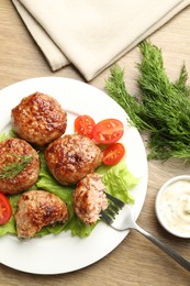 Photo of Delicious patties served on wooden table, flat lay