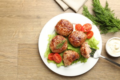 Photo of Delicious patties served on wooden table, flat lay. Space for text