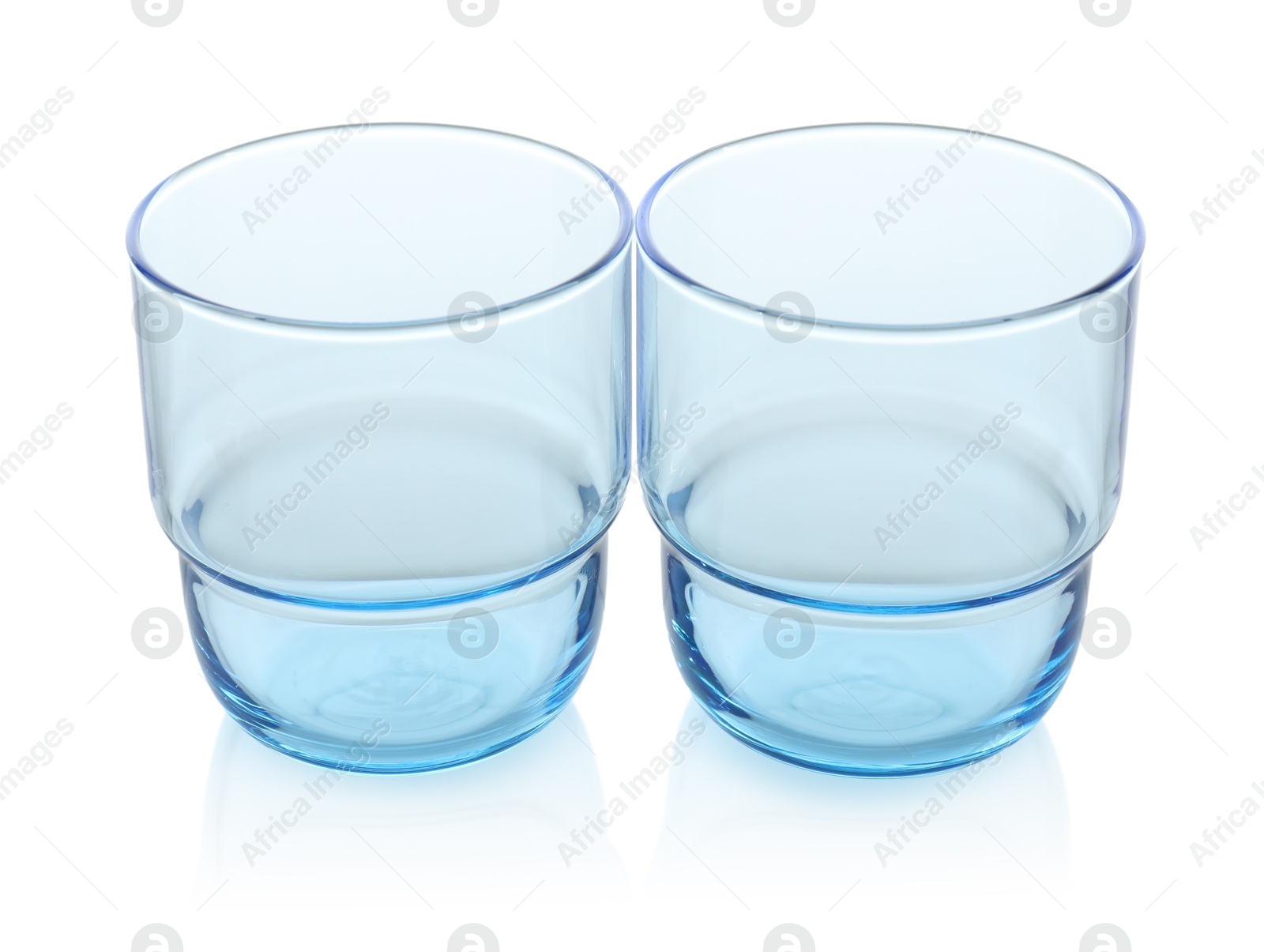 Photo of Two empty clean glasses isolated on white