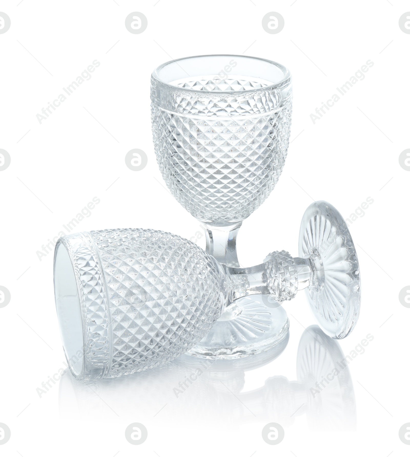 Photo of Two empty clean glasses isolated on white