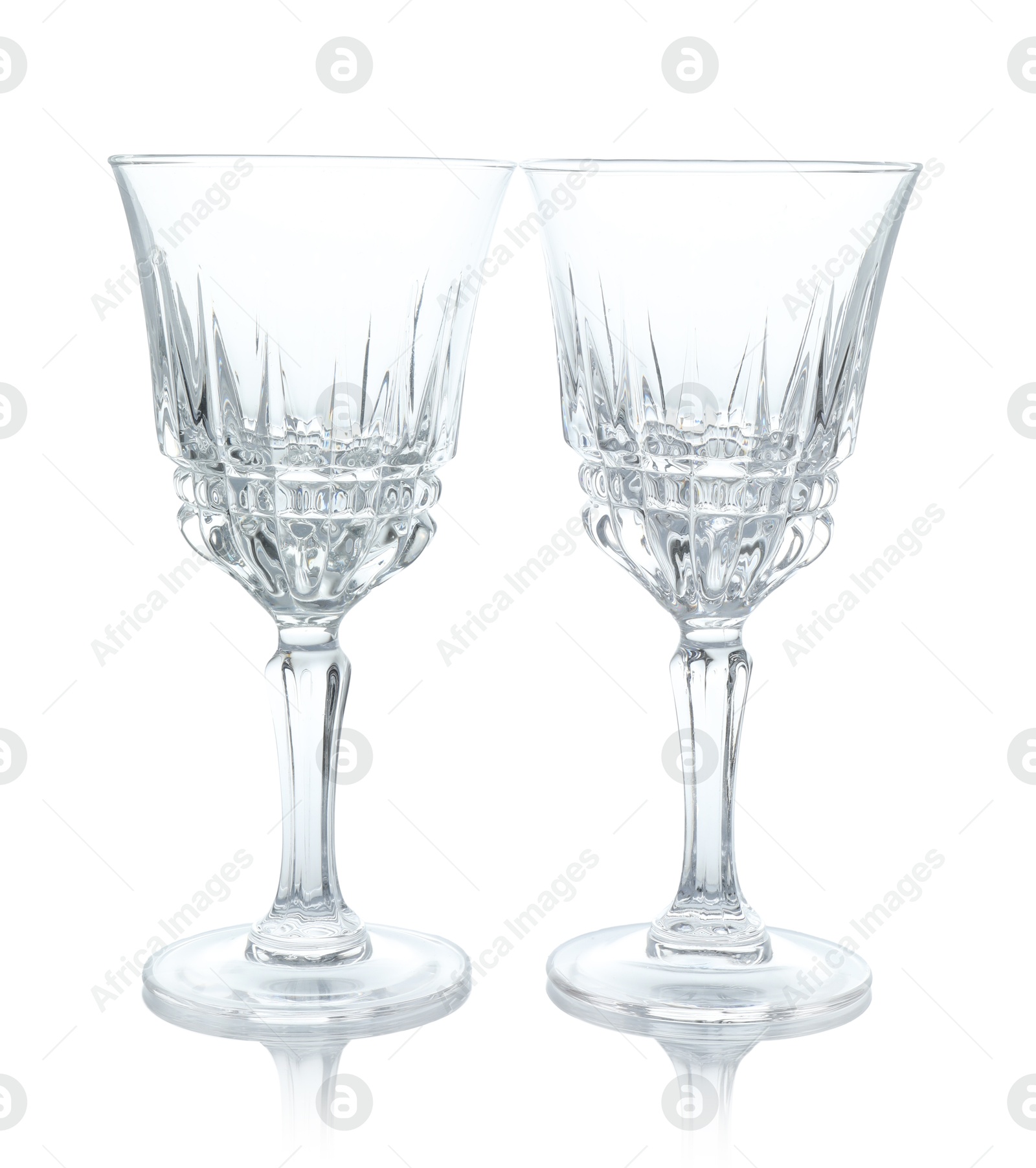 Photo of Two empty clean glasses isolated on white