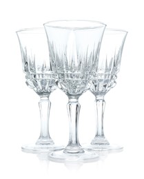 Photo of Three empty clean glasses isolated on white